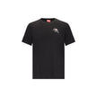 Black Cotton T-ShirtThe T-Adjust-T3 T-shirt by Diesel is a short-sleeved cotton tee featuring a classic crew neck. The design is enhanced by a graphic print and a logo detail, adding a modern, urban touch ideal for completing bold everyday looks. Season: