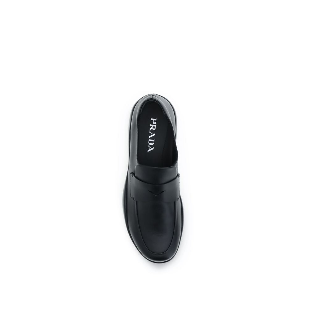 Schwarze Slip-On-Slipper aus Leder mit Gummisohle